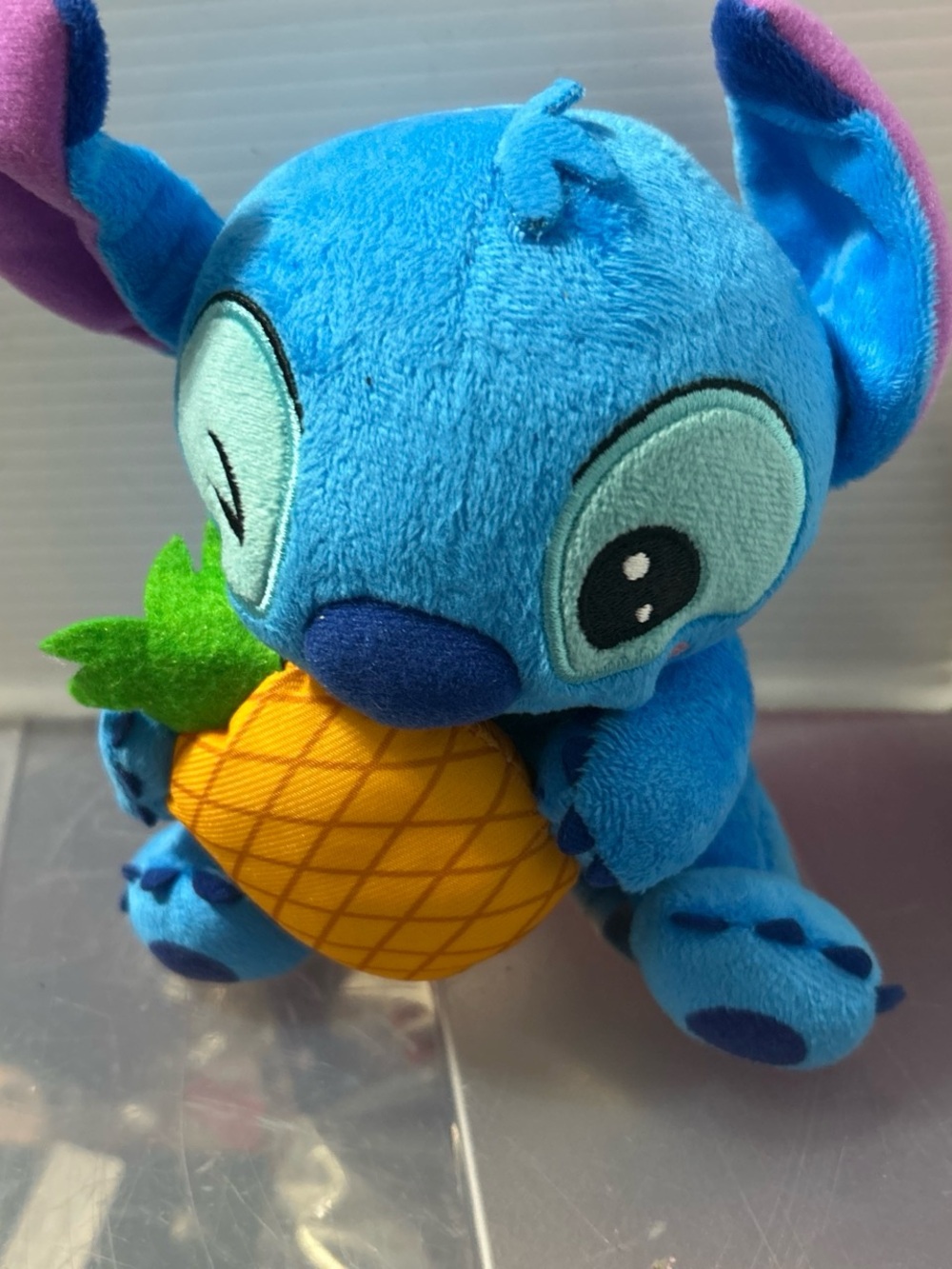 Blue Plush Alien Stuffed Toy Holding Yellow Pineapple
